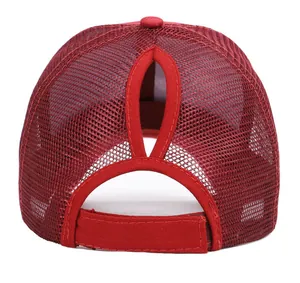 Detail of red mesh ponytail baseball cap with adjustable strap and hair opening