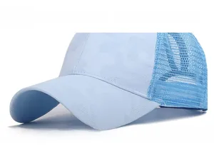 Close-up of light blue camouflage baseball cap featuring breathable mesh panels