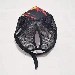 Detail view of the teardrop-shaped rear opening and breathable black mesh for ponytail