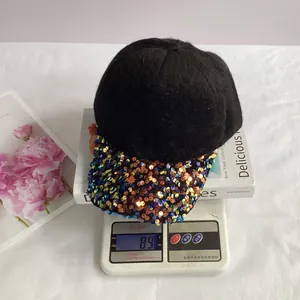 Detailed view of mohair sequined baseball cap on a scale weighing 89 grams