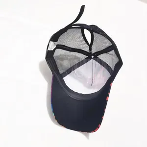 Detail of breathable mesh baseball cap with ponytail hole and colorful dot pattern