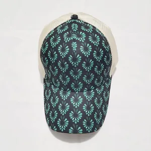 Detail of floral tie-dye print on the brim and mesh back of this ponytail baseball cap