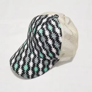 Detail view of the geometric zigzag pattern and breathable beige mesh on the trucker hat