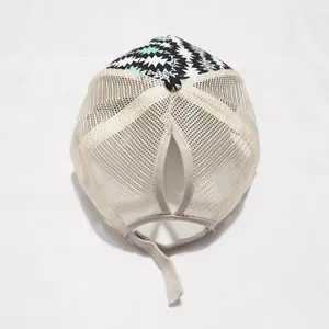Detail of printed mesh ponytail hat with high opening and adjustable velcro closure