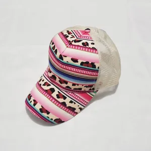 Detailed close-up of breathable beige mesh and pink tie-dye leopard print baseball cap