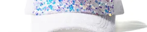 Close-up of fluffy white mohair fabric and shimmering colorful sequins on a baseball cap