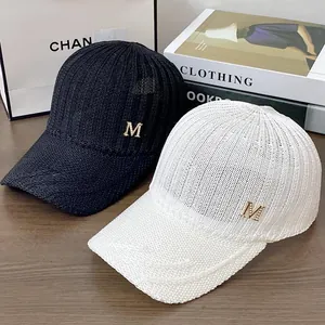 Knitted breathable sun baseball caps in black and white with gold M letter metal accent