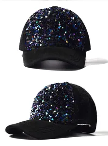 Detailed view of colorful sequins and plush mohair fabric on a black baseball cap