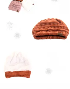 Detail of the thick knit beanie showing warm fleece lining and star leather patch label