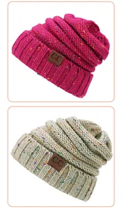 Detail of winter confetti yarn beanies in rose and beige with C.C leather logo patch