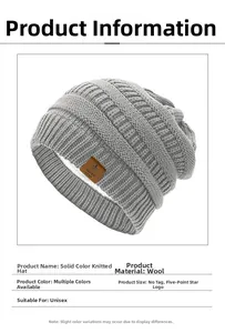 Detailed view of dark grey knit beanie with plush fleece lining and star leather patch