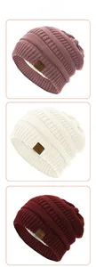 Detail view of winter knitted beanie hats with warm fleece lining and star leather patch