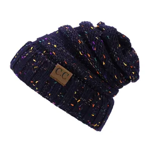Winter chunky knit beanie in navy blue with colorful speckles and leather C.C patch