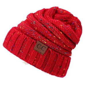 Red confetti knit beanie with brown C.C leather patch and colorful flecks for winter