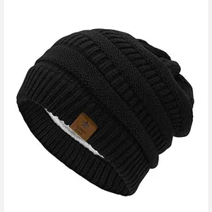 Black star knitted beanie with warm fleece lining and Super Star leather patch for winter