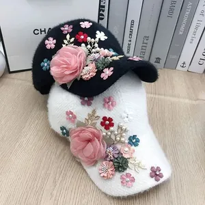 Close-up of plush baseball cap with 3D fabric flowers, pearls, and rhinestones