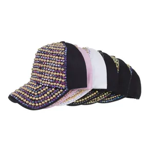 Detail of heavy industry baseball caps with intricate beads and colorful rhinestones