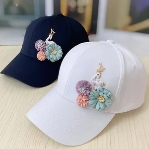 Handmade flower and deer applique baseball caps for women in black and white colors