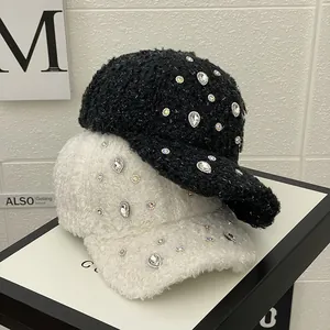 Detail of elegant baseball caps with sparkling rhinestones on textured faux fur fabric