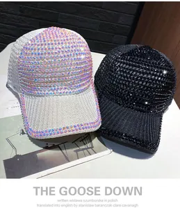 Close-up of sparkling rhinestone details on black and white stylish baseball caps