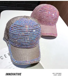 Close-up of mesh baseball caps featuring glittering rhinestones in pink and gold