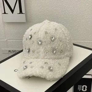 Detail of white fleece baseball cap with sparkling water-drop rhinestones and soft texture