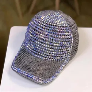 Macro detail of grey mesh baseball cap featuring colorful rhinestones and curved brim