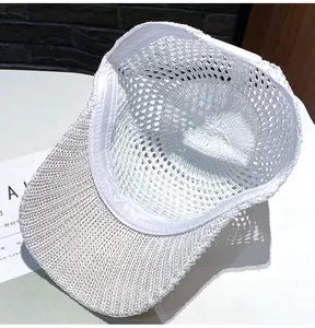 Detail view of white breathable mesh baseball cap showing interior sweatband and strap