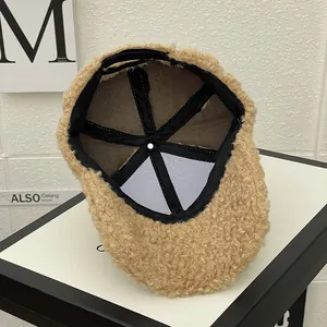 Detailed interior of a brown fleece baseball cap with sweatband and warm lining