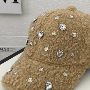 Detail of khaki faux shearling baseball cap decorated with sparkling rhinestones