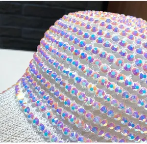 Macro shot of sparkling rhinestones on white mesh breathable baseball cap fabric