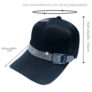 Detail of black satin baseball cap featuring rhinestone band and adjustable buckle