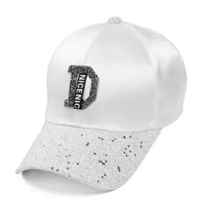White satin baseball cap with sparkling D logo and silver glitter brim for women