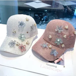 Chic knitted hollow-out baseball caps with decorative flowers and pearls in cream and pink