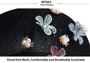 Close-up of black mesh knit cap with lace butterflies, pearl accents and floral embroidery