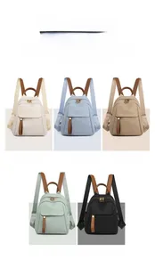 Detailed grid of oxford cloth backpacks in five colors with brown leather accents