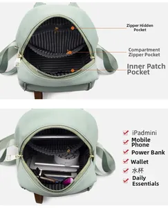 Internal storage layout of mint green oxford backpack showing striped lining and pockets