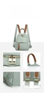 Detail view of smooth zippers, comfortable handle, and reinforced stitching on oxford backpack