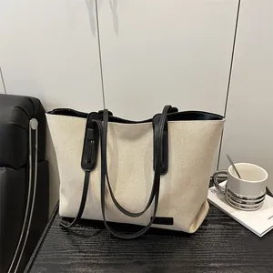 Borsa tote minimalista in tela beige con manici in pelle nera per ufficio e moda