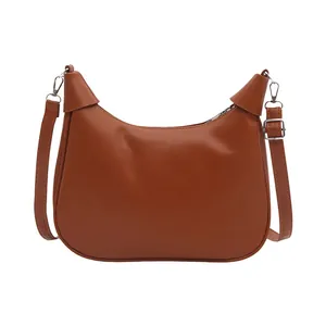 Retro brown crescent shoulder bag in smooth vegan leather with adjustable strap
