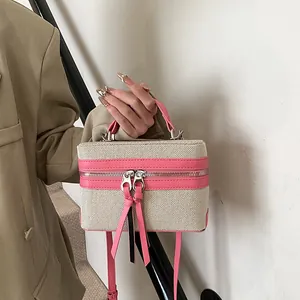 Contrast panel box tote bag in beige canvas and pink leather with stylish long tassels