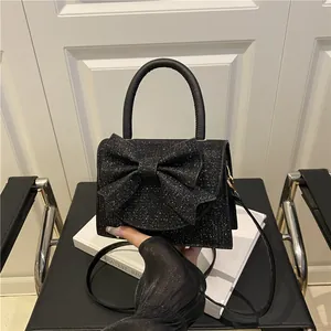 Sac de soirée noir pailleté élégant avec grand nœud et bandoulière réglable
