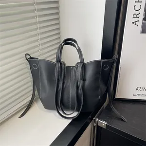Retro black litchi pattern tote bag with white contrast stitching and dual straps