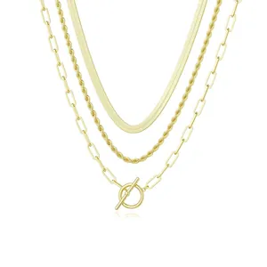 Detail of gold layered chain set featuring snake, twist rope, and paperclip chains with OT toggle