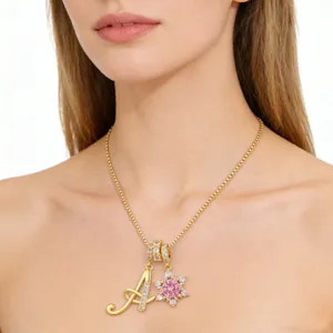 Gold letter A necklace with pink flower pendant and zircon stones on box chain