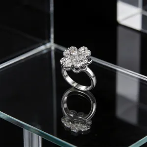 Macro shot of silver flower ring featuring cubic zirconia petals and clear reflections