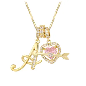 Detailed close-up of golden letter A pendant with pink heart and arrow on box chain