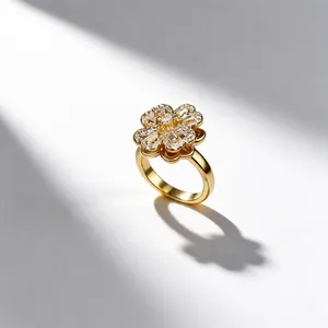 Macro shot of rotating four-leaf clover ring with micro-set zircon stones in gold finish