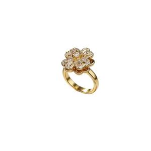Elegant rotating four-leaf clover ring in gold finish with sparkling zircon stones