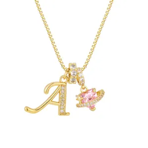 Conjunto collar dorado con colgante Saturno corazón rosa y letra A con circones